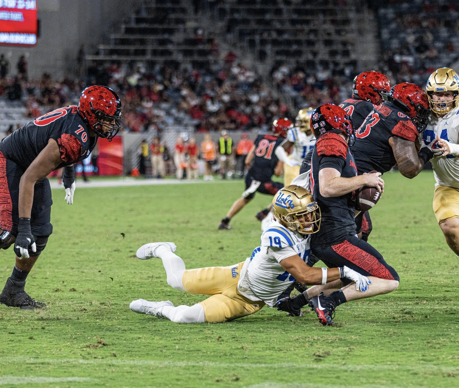 DJ Justice making a tackle during a UCLA night game